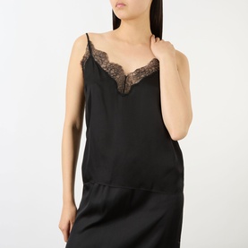 Model wearing Anine Bing Mael Lace-Trim Cami in black with V-neckline, lace trim detail and narrow adjustable straps, paired with black skirt.