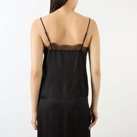 Model wearing Anine Bing Mael Lace-Trim Cami in black, showing back view with lace trim detail and narrow adjustable straps