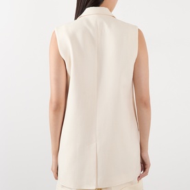 Model wearing Anine Bing cream sleeveless gilet, shown from the back, with notched collar and centre back vent.