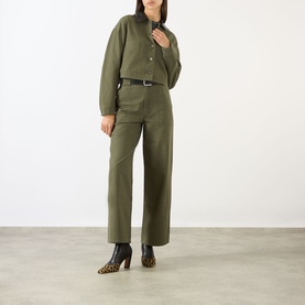 Model wearing Anine Bing Yuma Cropped Jacket in Army Green with matching wide-leg trousers, black belt, and leopard-print heeled boots.