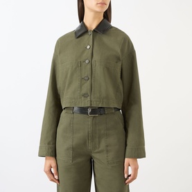 Model wearing Anine Bing Yuma Cropped Jacket in Army Green with black leather collar, paired with matching wide-leg trousers and black belt.