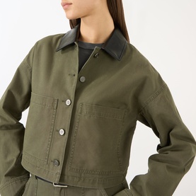 Model wearing Anine Bing Yuma Cropped Jacket in Army Green with dark leather-look collar, patch pockets, and button fastening
