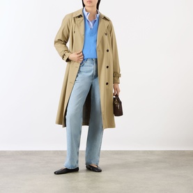 Model wearing Anine Bing blue cashmere knit, styled with beige trench coat, light-wash wide-leg jeans and black ballet flats.