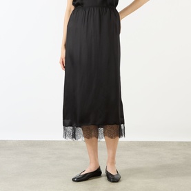 Model wearing Anine Bing black silk-blend midi skirt with lace hem trim, styled with black ballet flats