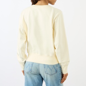 Model wearing Anine Bing Washed Buttercream sweat top, back view, styled with light blue denim jeans.
