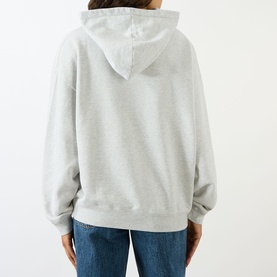 Model wearing Anine Bing grey cotton hoodie sweat top, back view, styled with blue jeans.