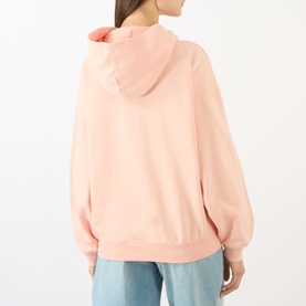 Model wearing Anine Bing blush hoodie sweatshirt, rear view, styled with light blue jeans.