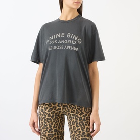 Model wearing Anine Bing washed black logo T-shirt with leopard print trousers