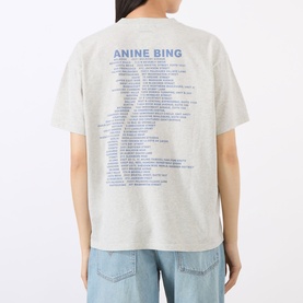 Model wearing Anine Bing Cade Wave Logo T-Shirt in Heather Grey, back view showing blue graphic print, styled with light wash jeans.