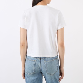 Model wearing Anine Bing white cotton T-shirt, back view, styled with light blue straight-leg jeans