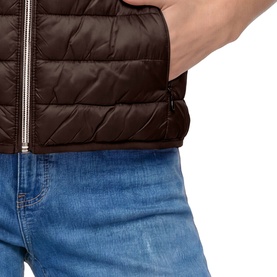 Model wearing Betty Barclay Quilted Zipped Gilet in Muskat, close-up of two-way zip and slit pocket detail, styled with blue jeans