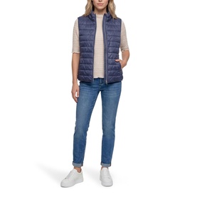 Model wearing Betty Barclay Quilted Zipped Gilet in Blue Horizon with stand-up collar, styled with grey tee, blue jeans and white trainers.