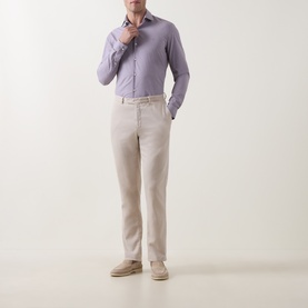 Model wearing Calvin Klein Violet Single Cuff Slim formal shirt with beige linen trousers and suede desert boots.
