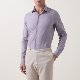 Model wearing Calvin Klein Violet Single Cuff Slim formal shirt with spread collar, styled with beige trousers.