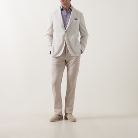 Model wearing Calvin Klein Violet Single Cuff Slim shirt, styled with cream blazer and taupe trousers and suede loafers.