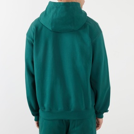 Model wearing Casablanca Sport hoodie in teal green, rear view, with matching teal joggers