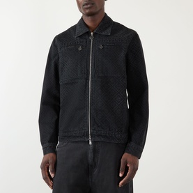 Model wearing Casablanca black cotton zip-through jacket with tonal embroidered panel detail, styled with matching black trousers.