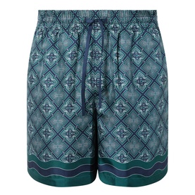 Casablanca Radiating Monogram silk shorts in teal and navy geometric tile print with drawstring waistband and wave border hem.