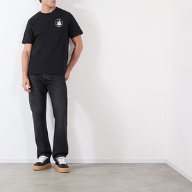 Model wearing Casablanca Casa Way Logo Graphic T-Shirt in black with small chest print, styled with dark jeans and black sneakers.