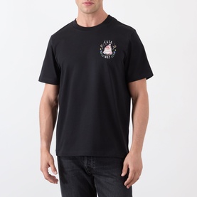 Model wearing Casablanca Casa Way Logo Graphic T-Shirt in black with small chest logo print, paired with dark jeans.