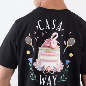 Model wearing Casablanca Casa Way Logo Graphic T-Shirt in black, showing back flamingo and tennis racket graphic print detail.