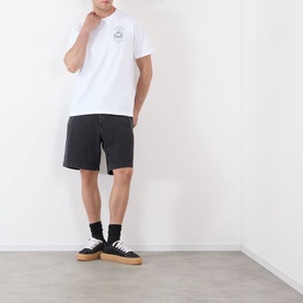Model wearing Casablanca Classic Logo Graphic T-Shirt in white with black shorts, black socks and tan-soled trainers.
