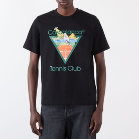 Model wearing Casablanca Tennis Club Icon Pyramid Abduction T-Shirt in black with multicolour triangle tennis graphic print, styled with grey jeans.