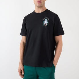 Model wearing Casablanca Hotel Emblem black cotton T-shirt with small graphic chest print, styled with green trousers.