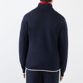 Model wearing Casablanca Logo Merino Wool Track Jacket in navy, rear view, showing contrast stripe trims and zip fastening, styled with matching navy