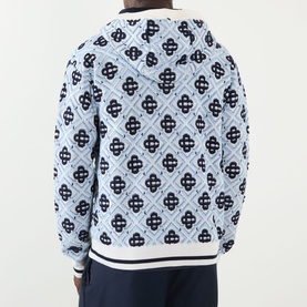 Model wearing Casablanca Monogram Logo Zip Sweatshirt in CC Monogram, light blue wool knit with all-over navy logo pattern, ribbed contrast trims,