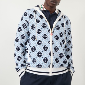 Model wearing Casablanca Monogram Logo Zip Sweatshirt in CC Monogram, light blue all-over pattern, hood, zip fastening, ribbed trims with contrast