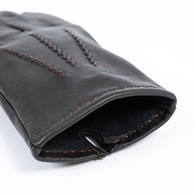 Dents brown leather gloves with contrast stitch detail and elasticated wrist, close-up view