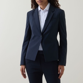 Model wearing Hugo Boss dark blue virgin wool blazer with single button fastening, styled with white shirt and matching trousers