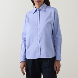 Model wearing Hugo Boss light pastel purple cotton blouse with classic collar and button front, styled with dark navy trousers