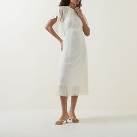 Model wearing Hugo Boss optic beige sheer midi dress with flutter sleeves, styled with nude strappy heeled sandals
