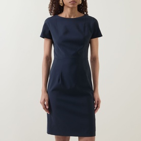 Model wearing Hugo Boss dark blue wool shift dress with short sleeves, bateau neckline and fitted silhouette to knee length.