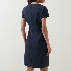 Model wearing Hugo Boss dark blue wool dress, back view, short sleeves, fitted silhouette with centre back vent and zip detail at neckline.