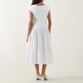 Model wearing Hugo Boss white midi dress, back view, ruched waist detail, tiered cotton skirt, paired with white heeled mules