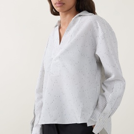 Model wearing Hugo Boss Batala Stripe Open Placket Shirt in Open White, featuring shirt collar, V-neckline, open placket, and long sleeves
