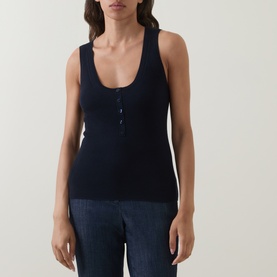 Model wearing Hugo Boss Fafflesia Rib-Knit Vest in dark blue with scoop neckline and half placket, styled with wide-leg trousers