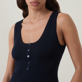 Model wearing Hugo Boss Fafflesia Rib-Knit Vest in dark blue, featuring scoop neckline, half placket button fastening and sleeveless ribbed design
