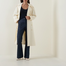 Model wearing Hugo Boss Fafflesia Rib-Knit Vest in Dark Blue, styled with cream trench coat and navy wide-leg trousers.