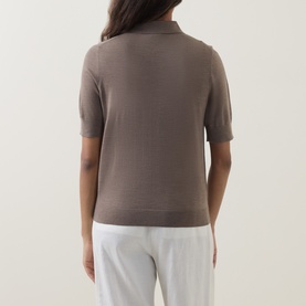 Model wearing Hugo Boss Fidenka Knitted Polo Shirt in Brown Overflow, rear view, short sleeves, ribbed trims, styled with white trousers