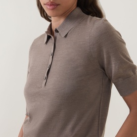 Model wearing Hugo Boss Fidenka Knitted Polo Shirt in Brown Overflow, showing polo collar, half placket, and short sleeves in fine-knit wool