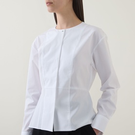 Model wearing Hugo Boss Beplum Collarless Shirt in white, featuring concealed front fastening, panelled construction and flared hem