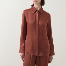 Model wearing Hugo Boss rust copper viscose shirt with classic collar and concealed placket, styled with matching wide-leg trousers