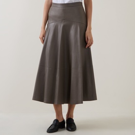 Model wearing Hugo Boss Brown Overflow leather midi skirt with flared A-line silhouette, styled with black loafers.
