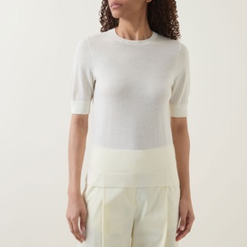 Model wearing Hugo Boss Farbella Knit Top in Open Beige, crew neck, short sleeves, ribbed trims, styled with cream wide-leg trousers.