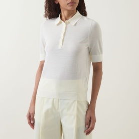 Model wearing Hugo Boss open beige virgin wool polo top with short sleeves and collar, styled with cream wide-leg trousers.