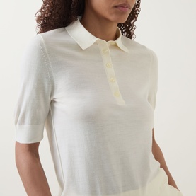 Model wearing Hugo Boss open beige virgin wool polo top with short sleeves and button placket, close-up detail shot